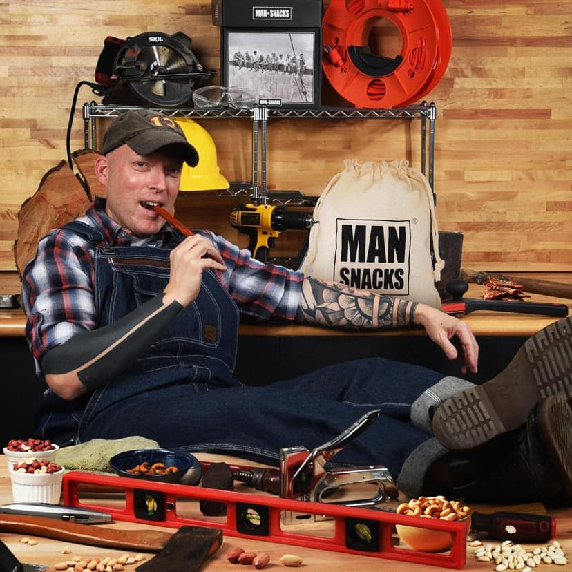 ManSnacks Deluxe Jerky & Nuts Gift Basket for Men - 28 pc - Large Variety of Beef Jerky Sticks, Pepperoni Sticks, Cheese Stick, Almonds, Peanuts & Pistachios, in a Manly Gift Bag